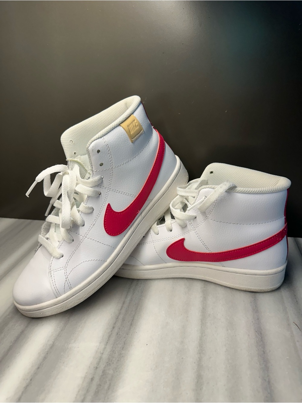 Nike White High-Top Sneakers with Pink Swoosh